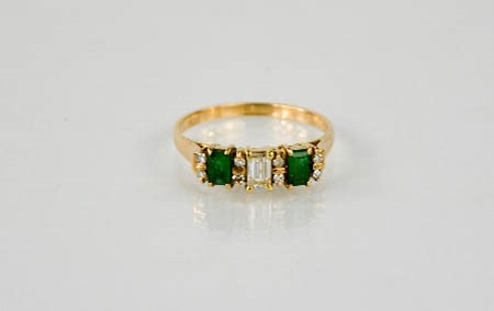 A 14ct yellow gold, emerald and diamond ring, size O, 2.8g.