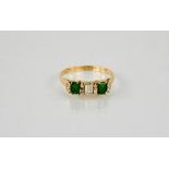 A 14ct yellow gold, emerald and diamond ring, size O, 2.8g.