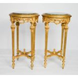 A pair of 19th century French giltwood and marble top stands, raised on fluted legs, cross stretcher