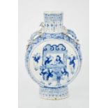 A 19th century blue and white moon flask, modelled with salamanders to the shoulders, and figural