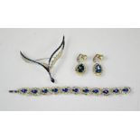 A sapphire and diamond style bracelet and matching earrings, set with blue and white paste stones,