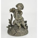 A bronze figure of a cherub playing a flute, bearing tag to the base.
