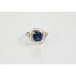 An 18ct white gold, blue sapphire and diamond ring, the sapphire approximately 3ct, and the diamonds