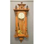 A 19th century Vienna wall clock with long glazed door and Roman numeral dial, 132cm high.