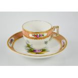 A 19th century Meissen miniature cup and saucer, painted with figural scenes, blue cross sword marks