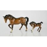 A group of four Beswick horses.