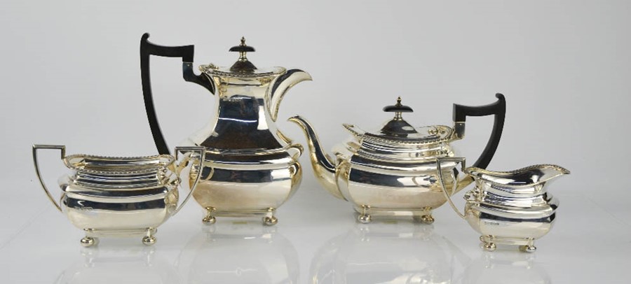 A silver tea service comprising tea pot, hot water pot, sugar bowl and milk jug, Sheffield 1964,