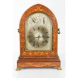 A 19th century mahogany inlaid quarter striking clock, circa 1890, with side handles and bracket