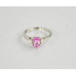 A platinum three stone ring, the pink sapphire 1.12ct total and diamond 0.2cts total, size L, 4.8g.