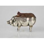 An Edwardian silver pin cushion in the form of a pig, by Adie & Lovekin Ltd, Birmingham 1905, 5cm