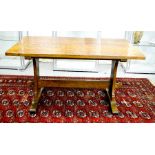 A Bob Hunter 'Wren Man' oak refectory table, with adzed top, on two supports and stretcher, circa