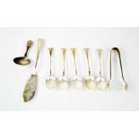 A group of silver spoons to include caddy spoon, five scallop form spoons, pair of sugar nips, a