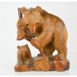 A 20th century Bavarian carved bear and cub, 30cm high.