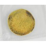 A Middle Eastern Salajiqah gold coin, approximately 1079 A.D., for Masood Bin Mohammed, with