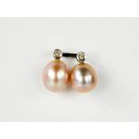 A pair of natural pink pearl, diamond and white gold stud earrings.
