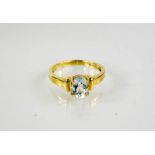 A 9ct gold and blue topaz oval cut ring, 2.8g.