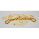 An ivory group of Victorian beads, and two beaded necklaces.