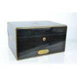 A fine Victorian dressing / vanity case, in ebonised mahogany, the fitted interior containing silver