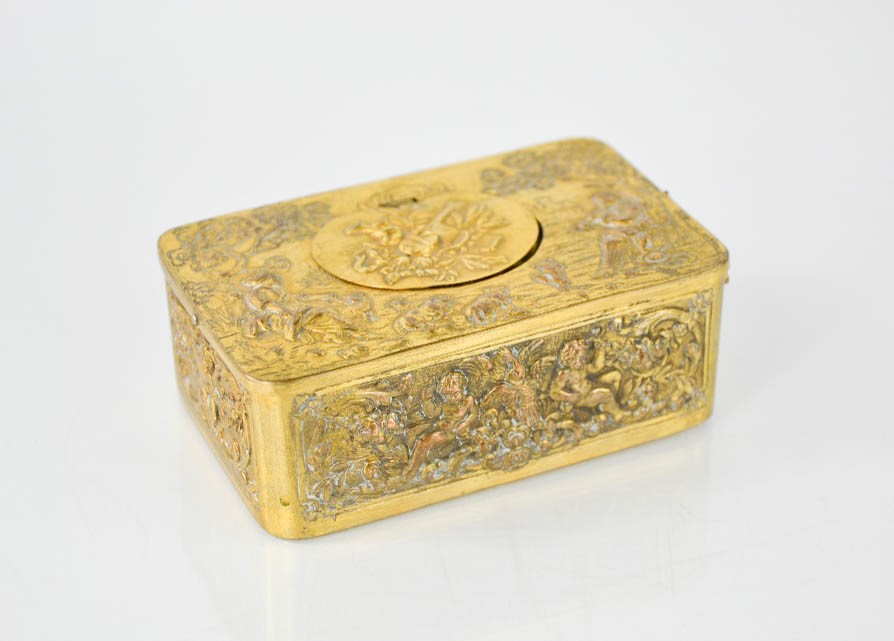 A 19th century French singing automaton bird musical box, the brass box cast with cherubs and