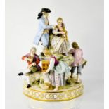 A 19th century Meissen figure group, six figures on leaf covered rock formation, round base with