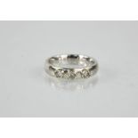 A 9ct white gold and diamond three stone ring, in a contemporary style 3.7g.