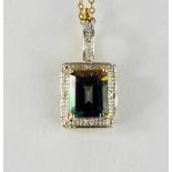 A 9ct gold, diamond and mystic topaz pendant necklace, square cut bordered by diamonds.