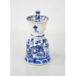 A 19th century Delft blue and white bell form incense holder.