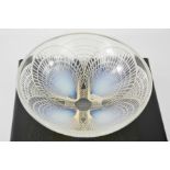 A Rene Lalique bowl, opalescent coquilles pattern bowl no. 3207, signed R. Lalique to the base, 21cm