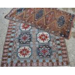Two rugs one Aztec style- 187cms x 152cms and 197cms x 97cms.