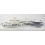 A Royal Worcester part dinner service comprising two tureens, six dinner plates, six side plates,