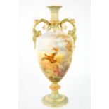A Royal Worcester porcelain twin handled vase, painted with partridges in landscape, date code 1911,