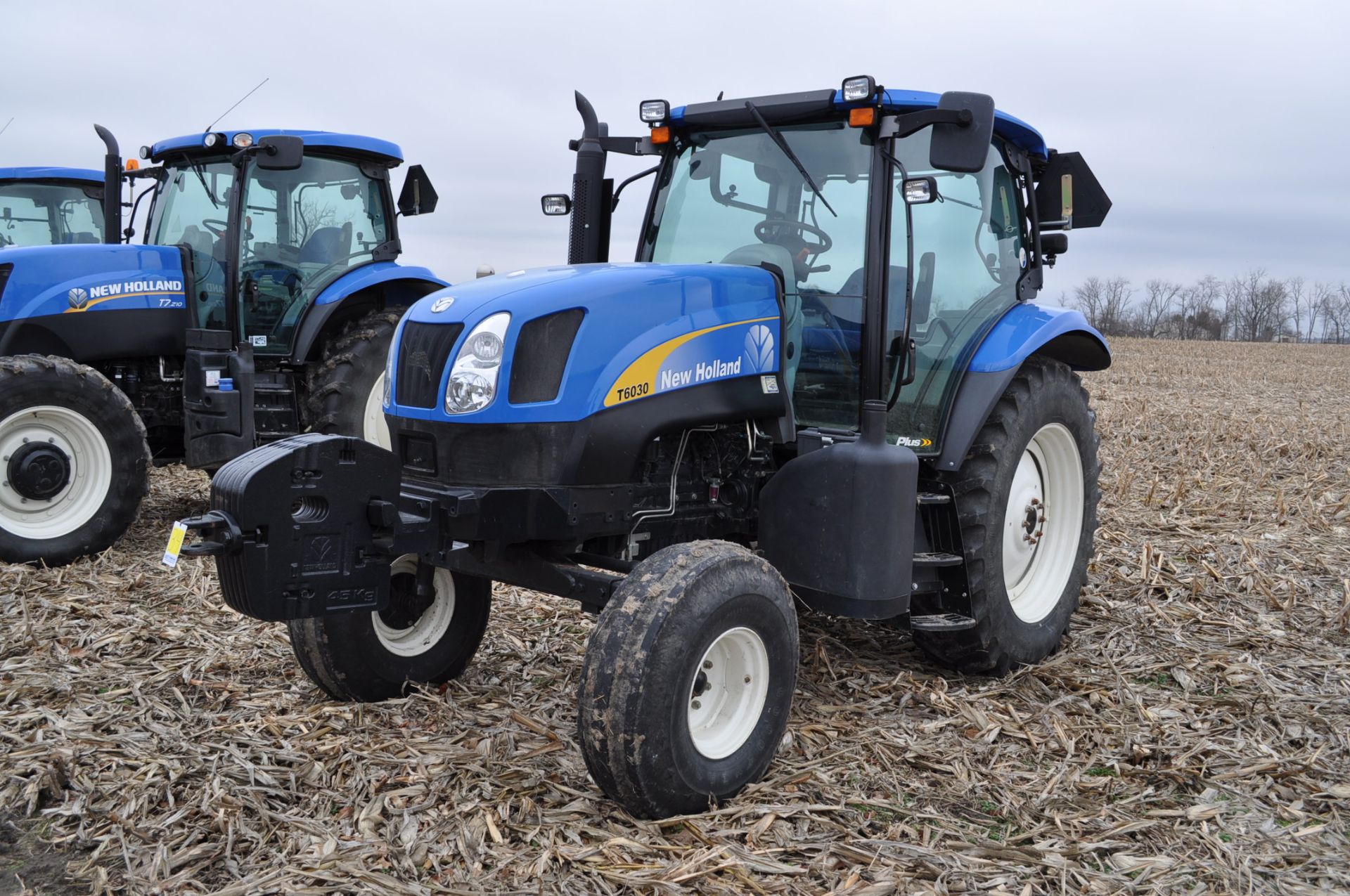 New Holland T6030 tractor, CHA, 16.9 R 38 tires, 11.00-16 front, 6 front wts, 3 hyd remotes, 3 pt,