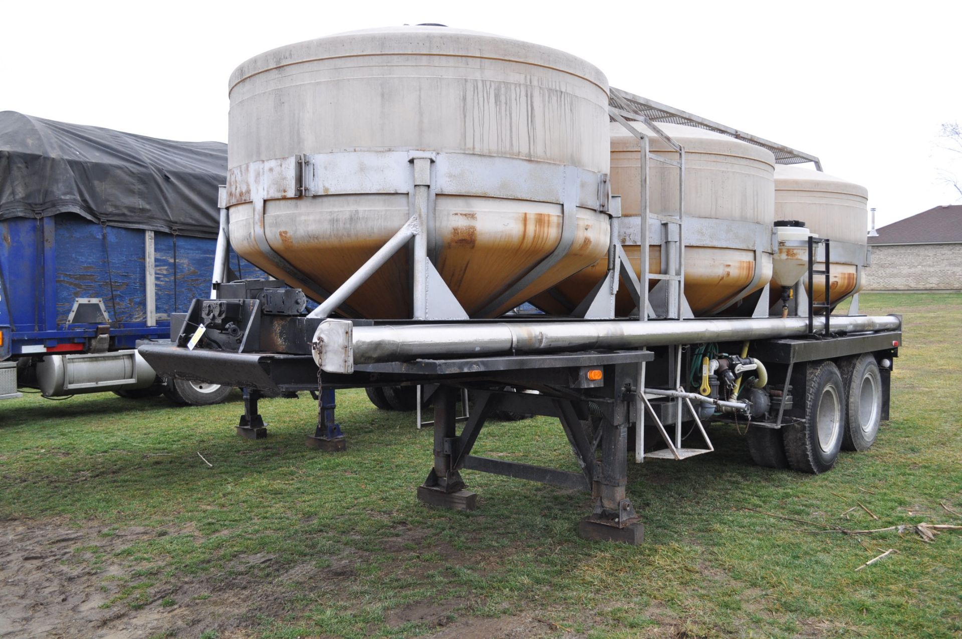 24’ Allied trailer, tandem axle, (3) 1200-gallon poly cone tanks, VIN CA700151