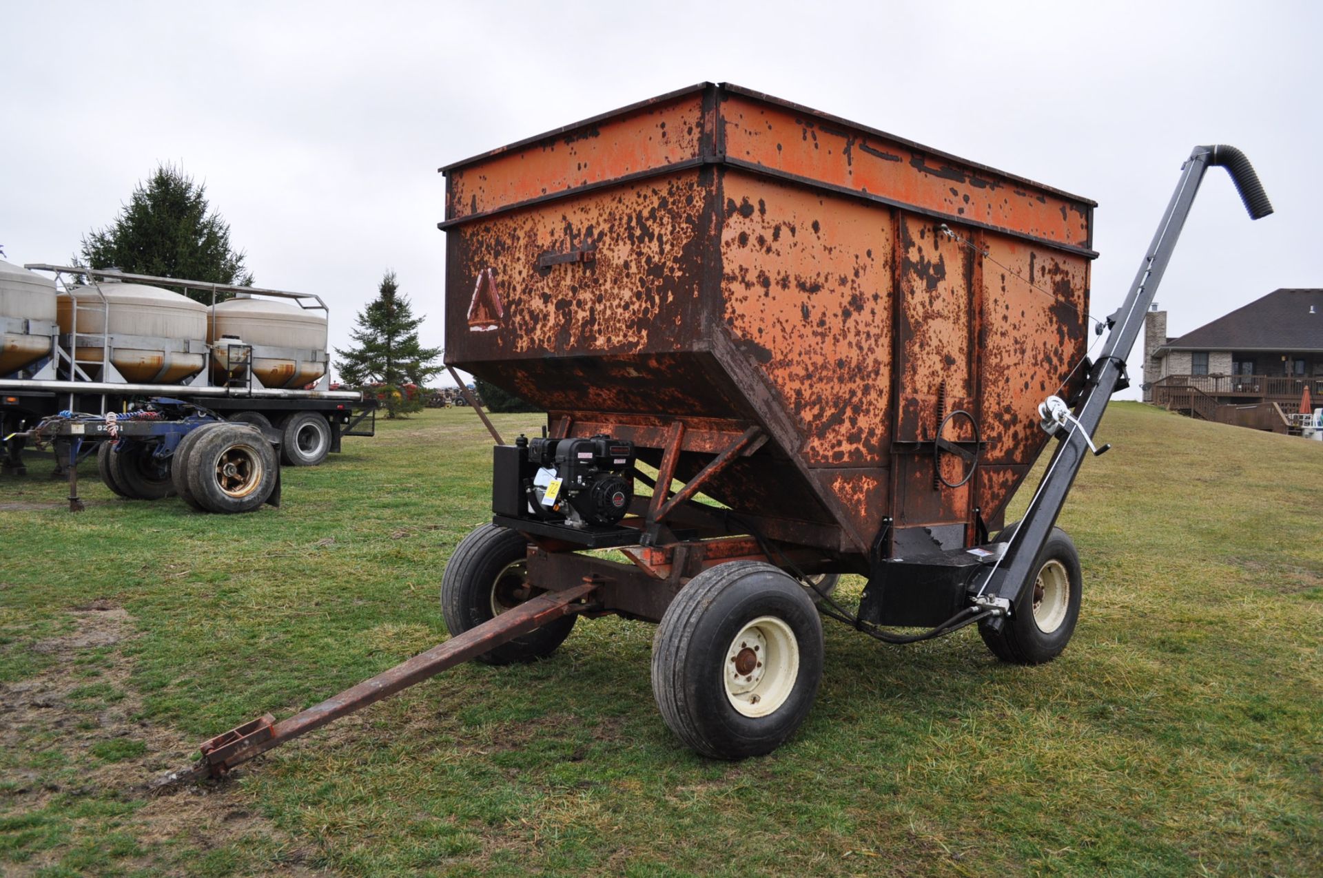 300 bushel gravity seed wagon, 15’ poly cup auger, hyd power unit, 12.5-15 tires