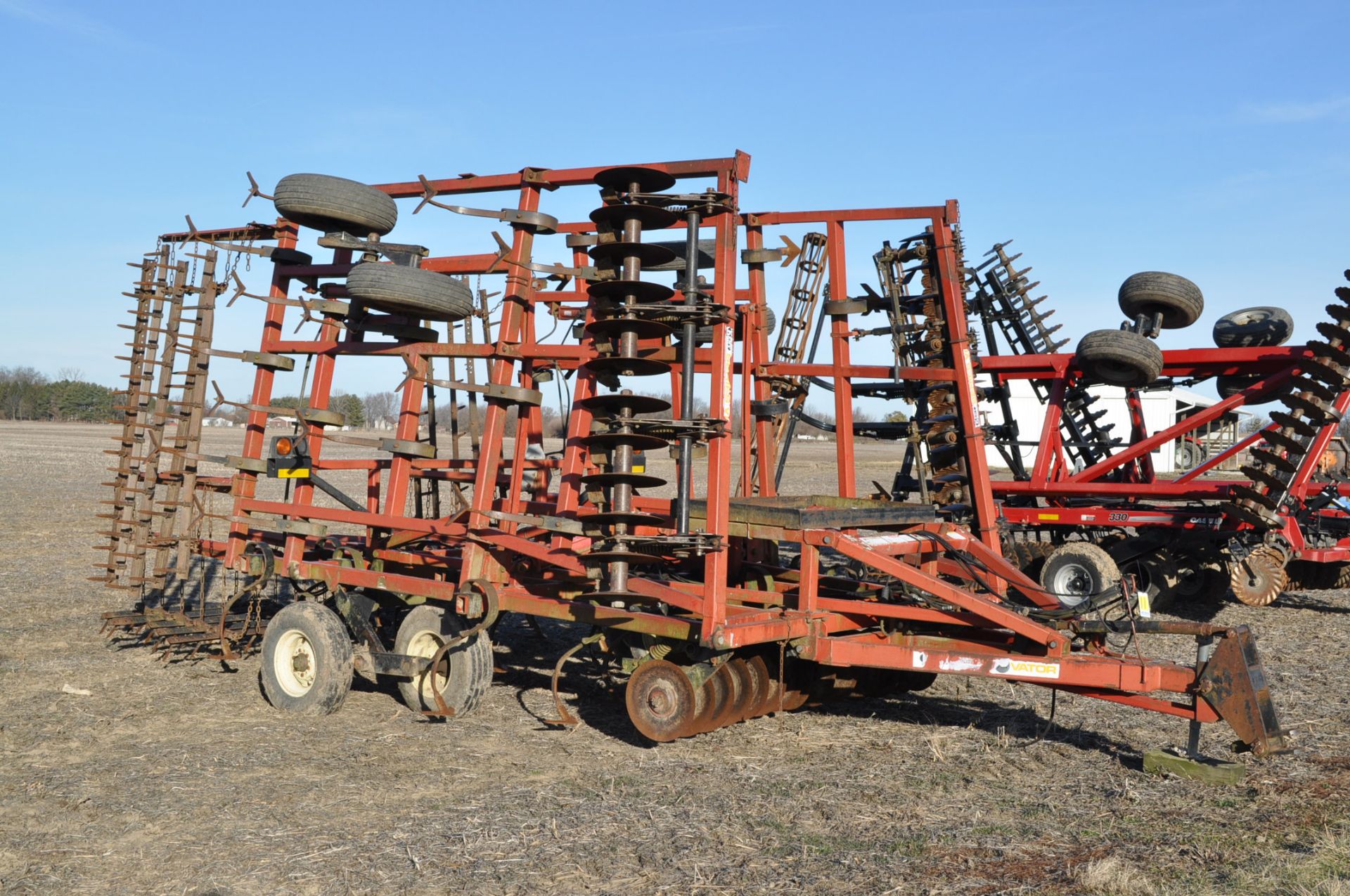 26’ Kent Disc-o-vator, front blades, sweep, 5-bar harrow, walking tandems