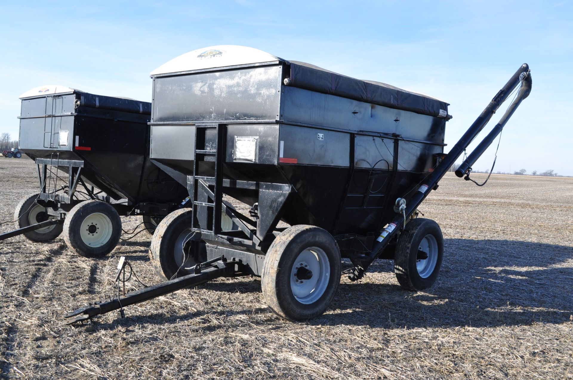 J & M 350 gravity seed wagon, 11 R 24.5 tires, 15’ poly cup auger, 3 section spout, Augermate hyd
