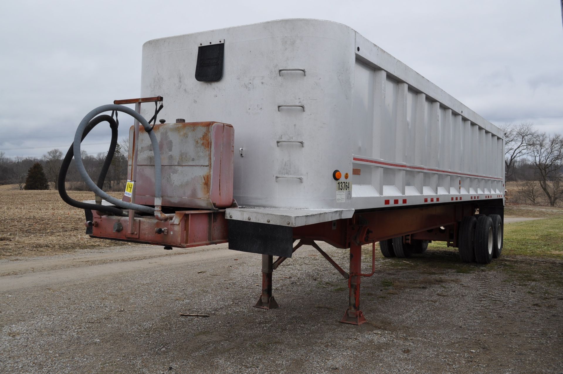 1989 34’ Fruehauf end dump aluminum trailer, 37’ steel frame, tandem axle, 11 R 22.5 tires, disc