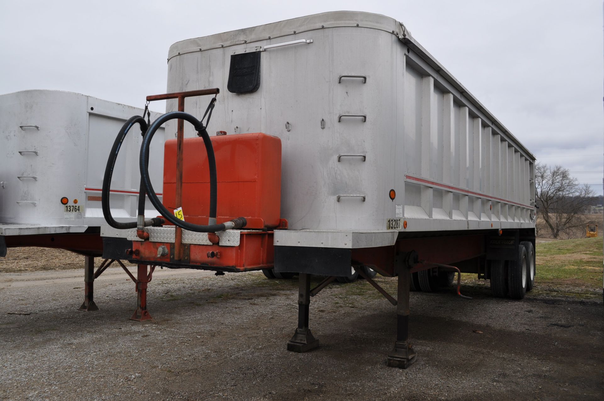 1986 33’ Fruehauf end dump aluminum trailer, 35’ steel frame, tandem axle, 11 R 24.5 tires, disc
