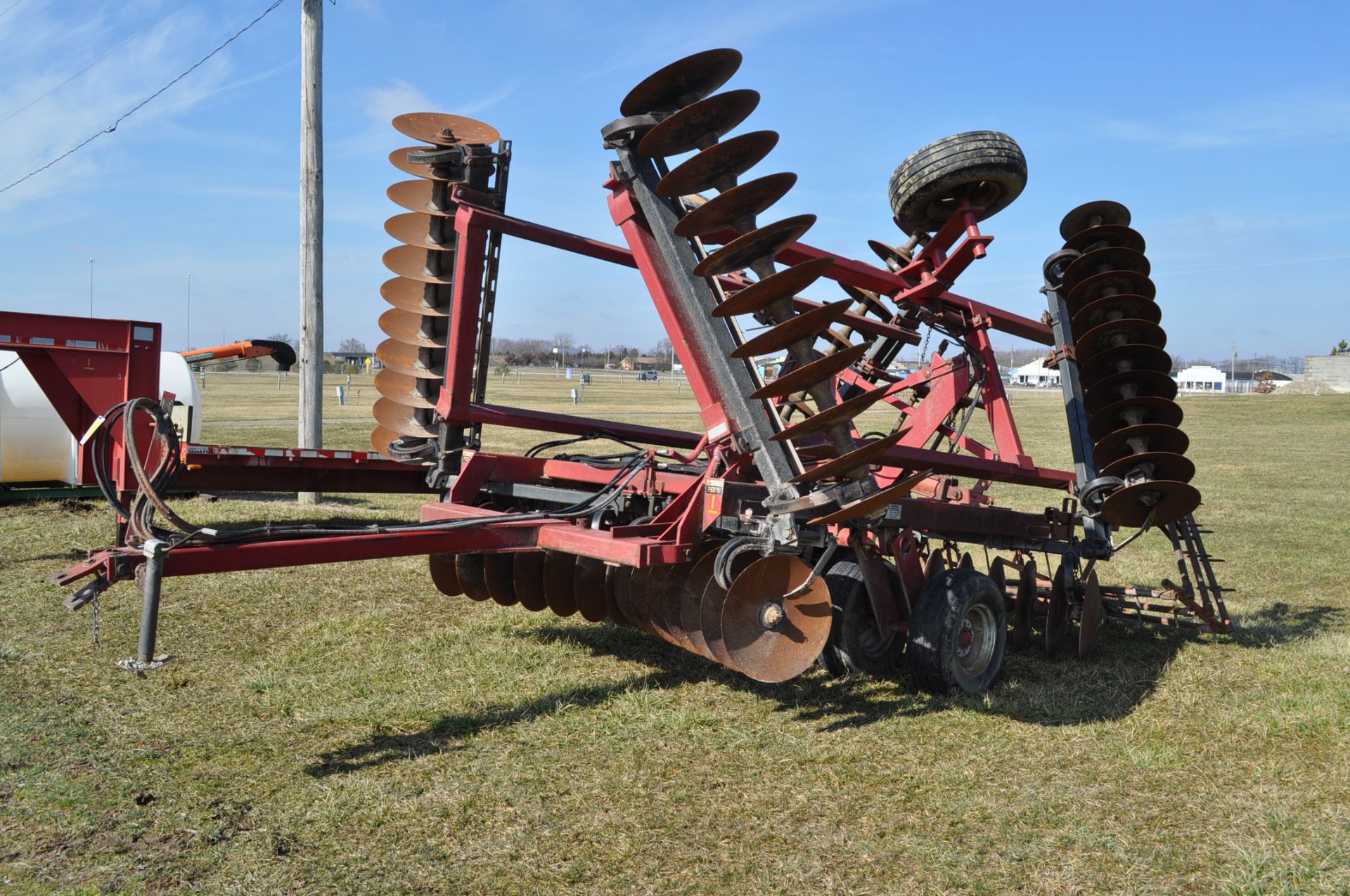 24’ Case IH 496 disc, rock flex, 7 ½” spacing, 3 bar spike tooth harrow, new blades