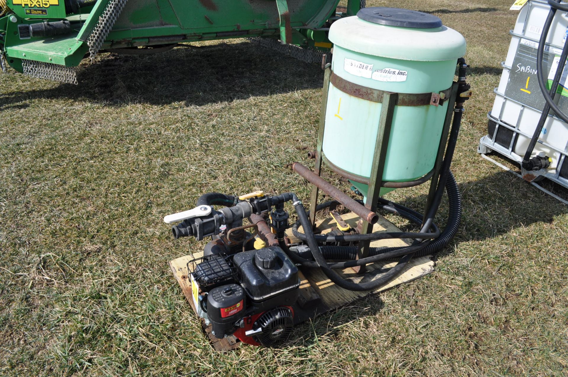 Banjo 2” cast pump with Briggs and Stratton engine, 35 gal inductor tanks with hose and stand
