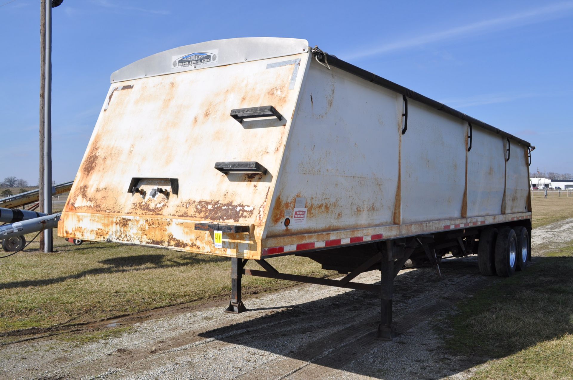 34’ Drake steel grain trailer, tandem axle, roll tarp, spring ride, 4 alum wheels,