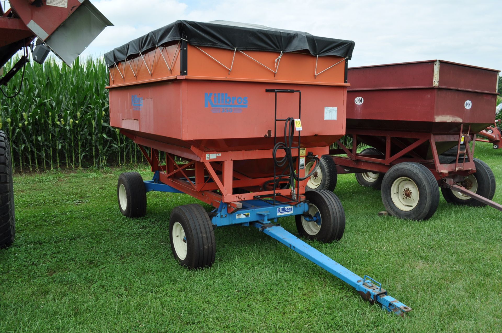 Killbros 350 gravity bed wagon on 10T gear, Unverferth McCurdy hyd seed auger, tarp, Firestone IF