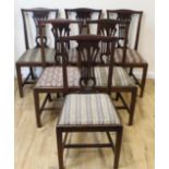 Set of six mahogany dining chairs each with pierced splat over slip in seat on square supports.