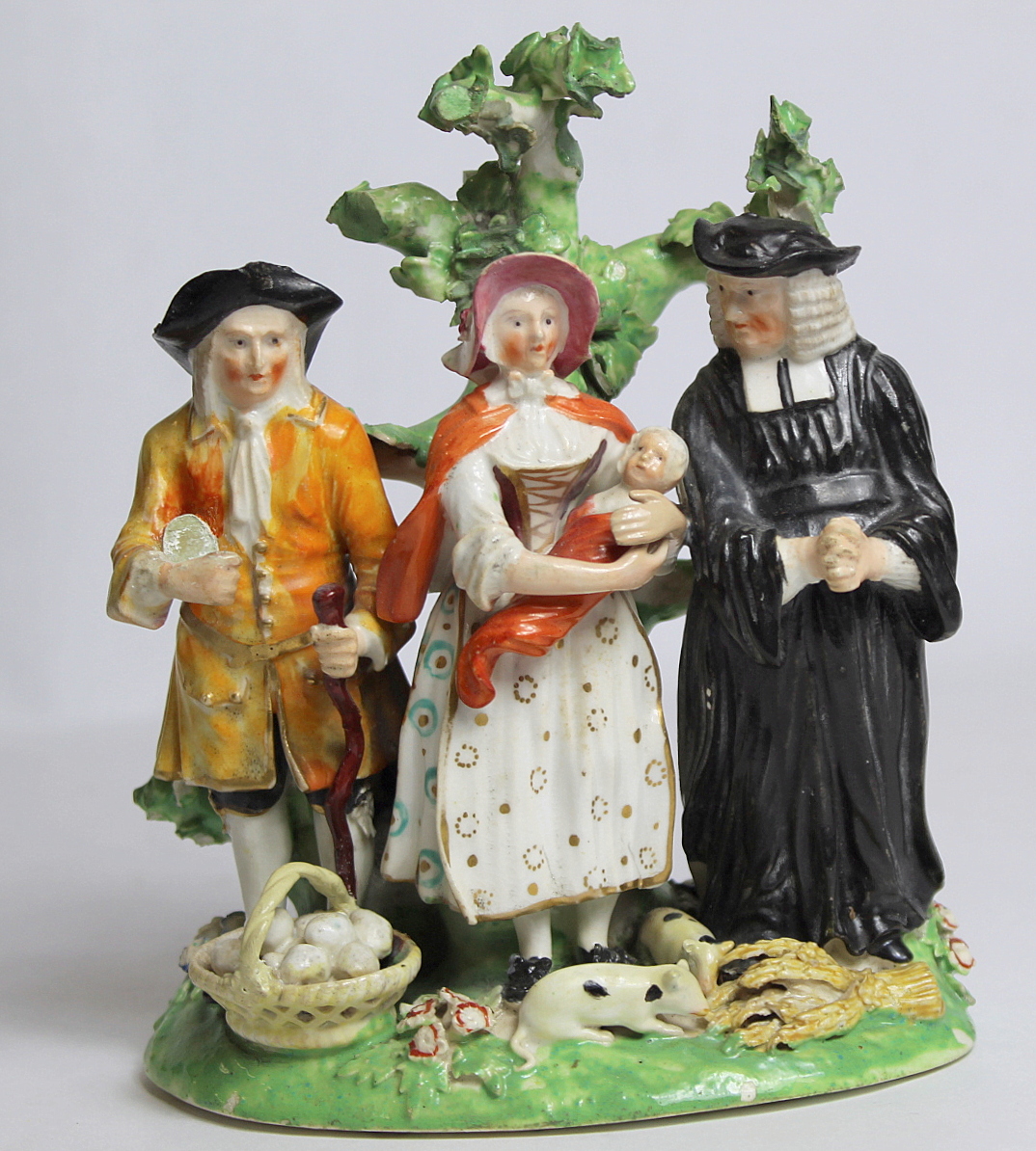 Early 19th century Derby Tythe Pig group with farmer, wife and parson standing on naturalistic