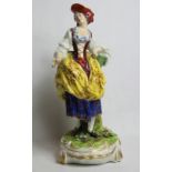 19th century Derby style porcelain pastoral figure of a girl with basket standing on plinth base