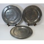 Three large antique pewter chargers with impressed initials M.R.D. to rims, indistinct worn marks,