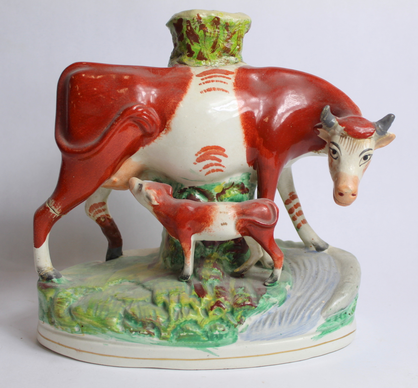 Two Staffordshire pottery spill vases in the form of a cow and calf on naturalistic plinth base with - Image 6 of 12