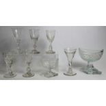 Six 19th century drinking glasses with facet cut bowls, baluster, knopped and faceted drawn stems,
