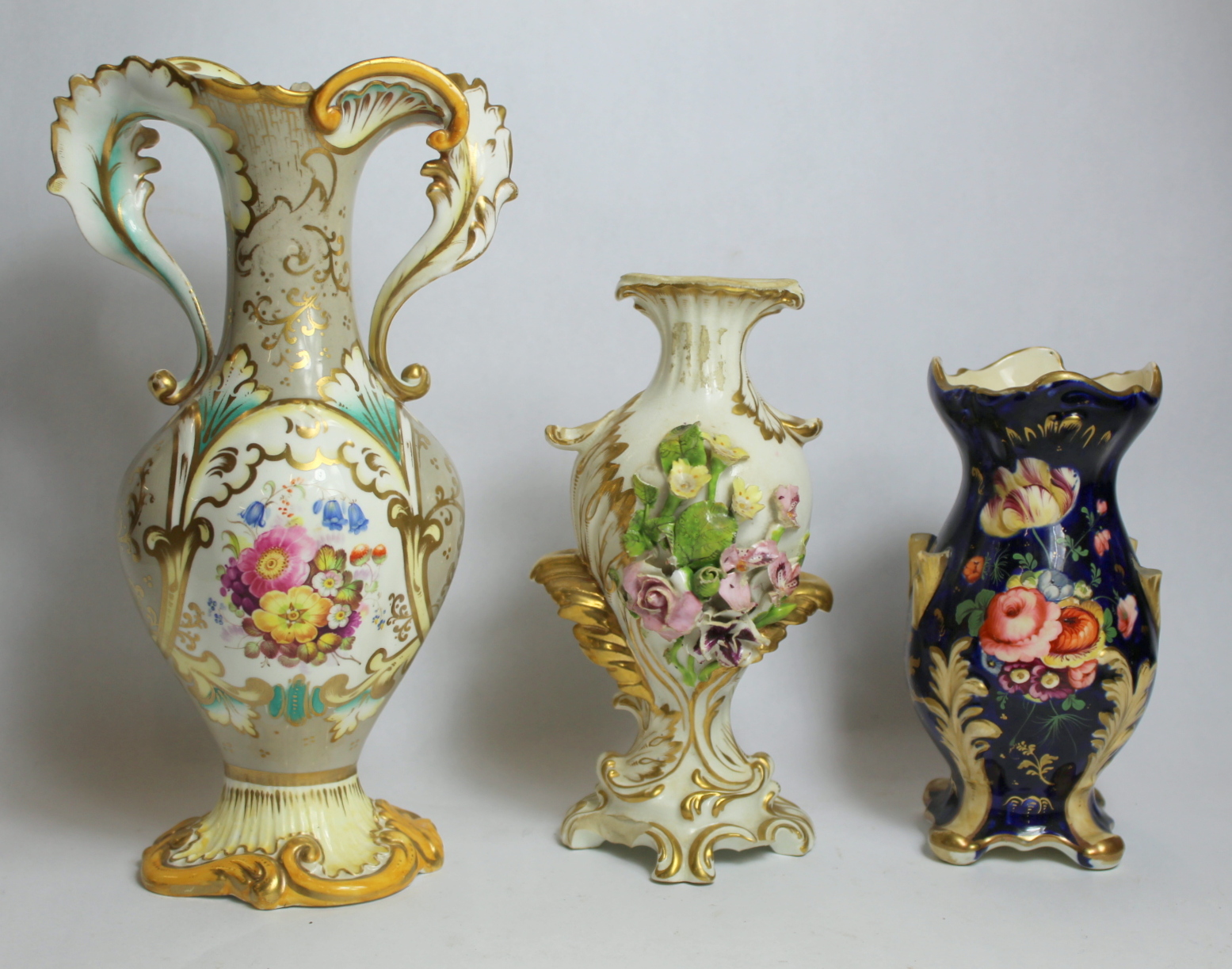 Early 19th century Derby porcelain vase with floral encrustation and moulded gilt foliate scrolling,