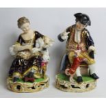 Pair of early 19th century Derby porcelain figures, no. 362, the boy playing with a dog dressed in a